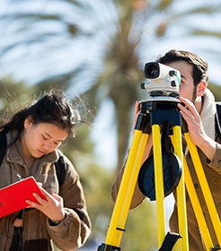engineering students looking through a scanner