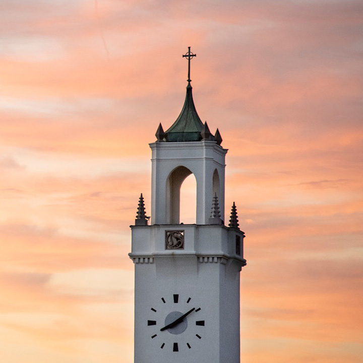 chapel tower with sunset in background