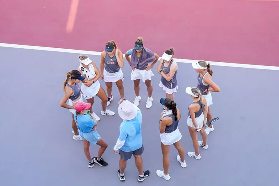 LMU Women's Tennis Team Huddles on the Court