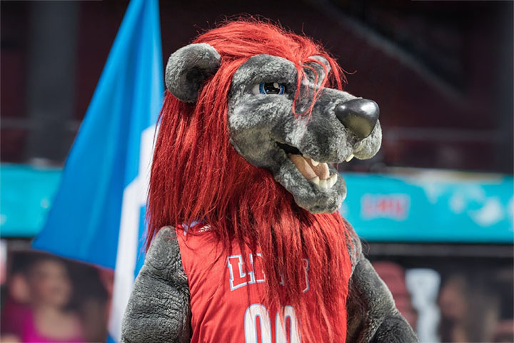 Iggy in Gersten Pavilion wearing a sleeveless athletic jersey with current LMU branding