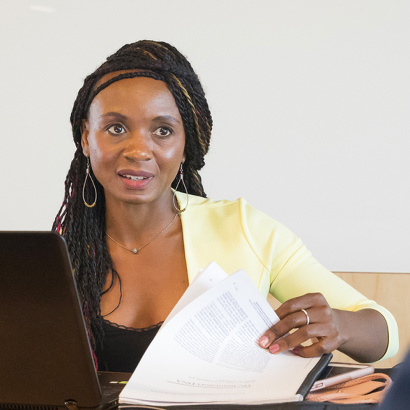 Student with laptop and papers