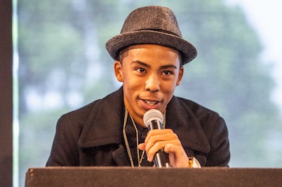 Male student speaking at TLC program