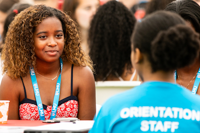 female first year student talking to orientation staff